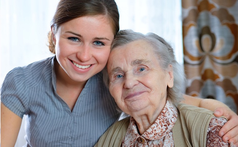 Hospice volunteer with elderly woman patient