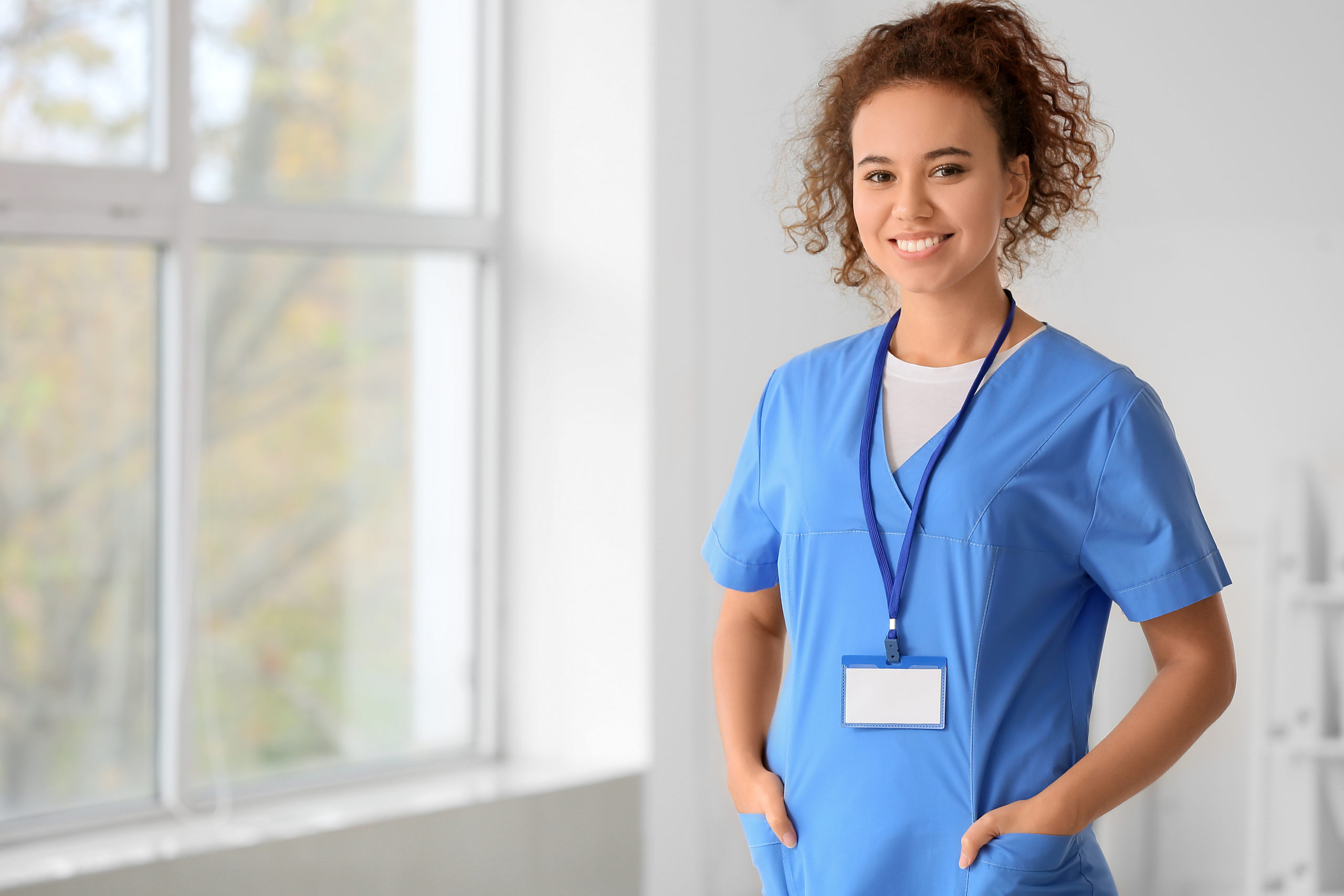 nurse standing on right hand side scaled